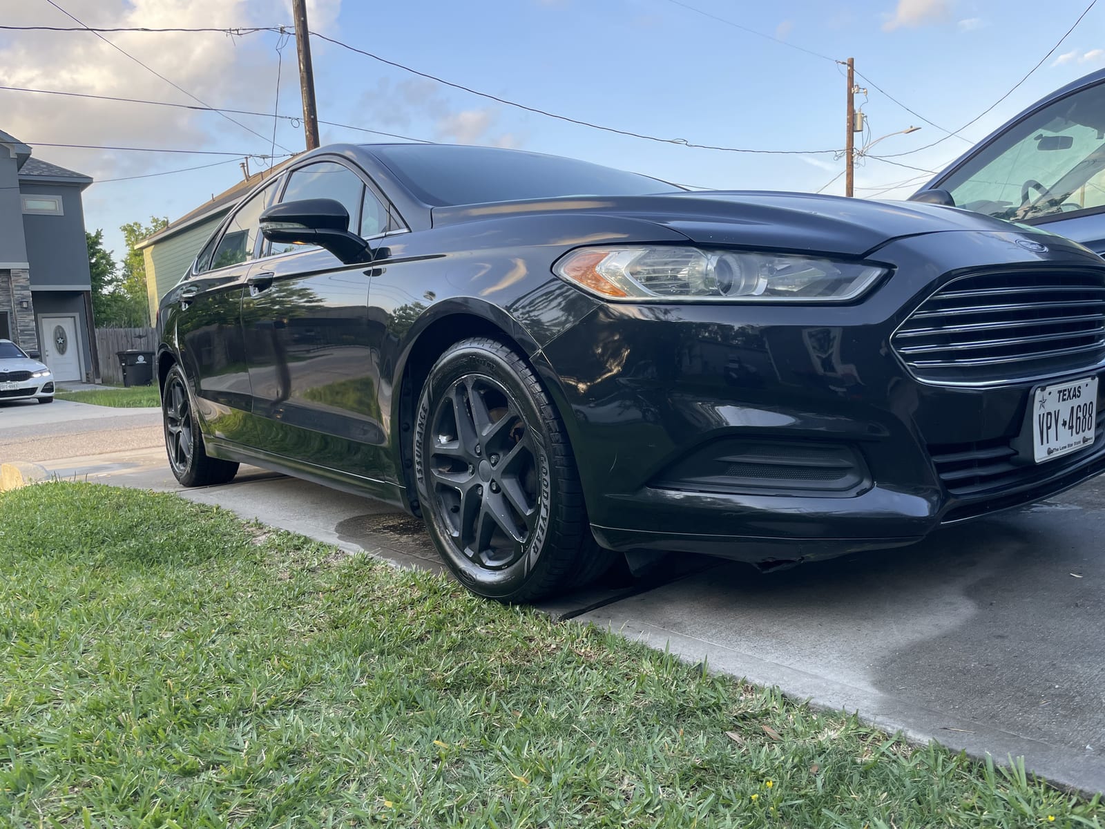 Black sedan after detailing — deep gloss shine
