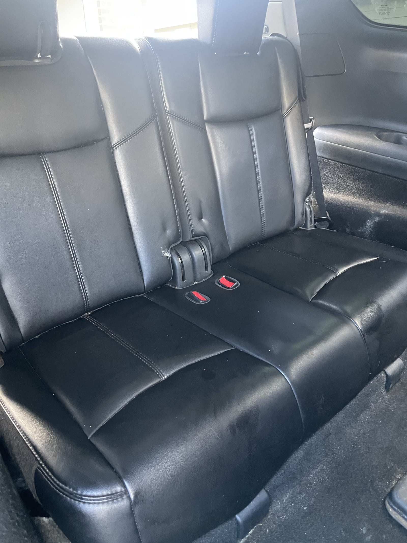 Car seat after detailing — spotless black leather